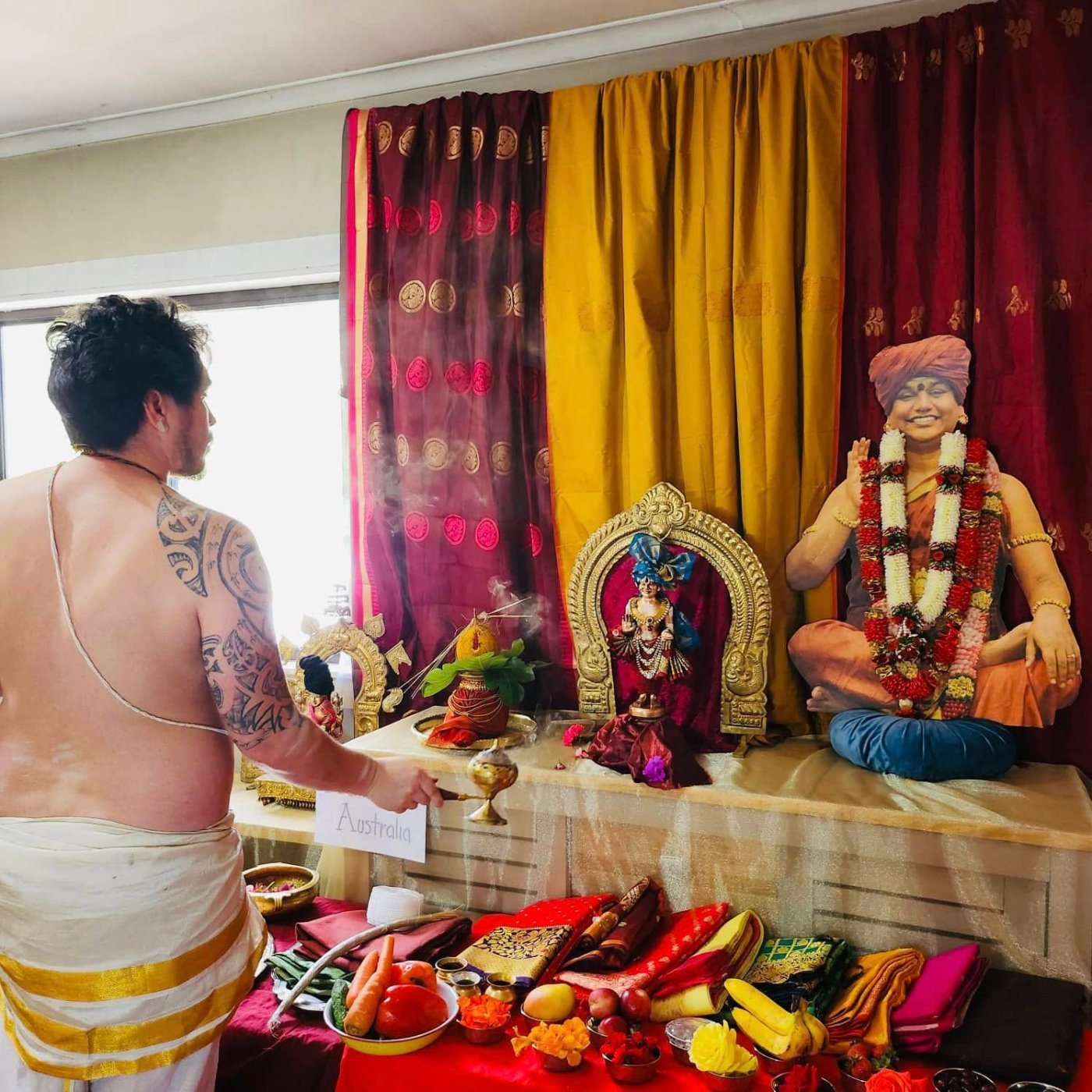 Devotees offering worship at a KAILASA Australia temple