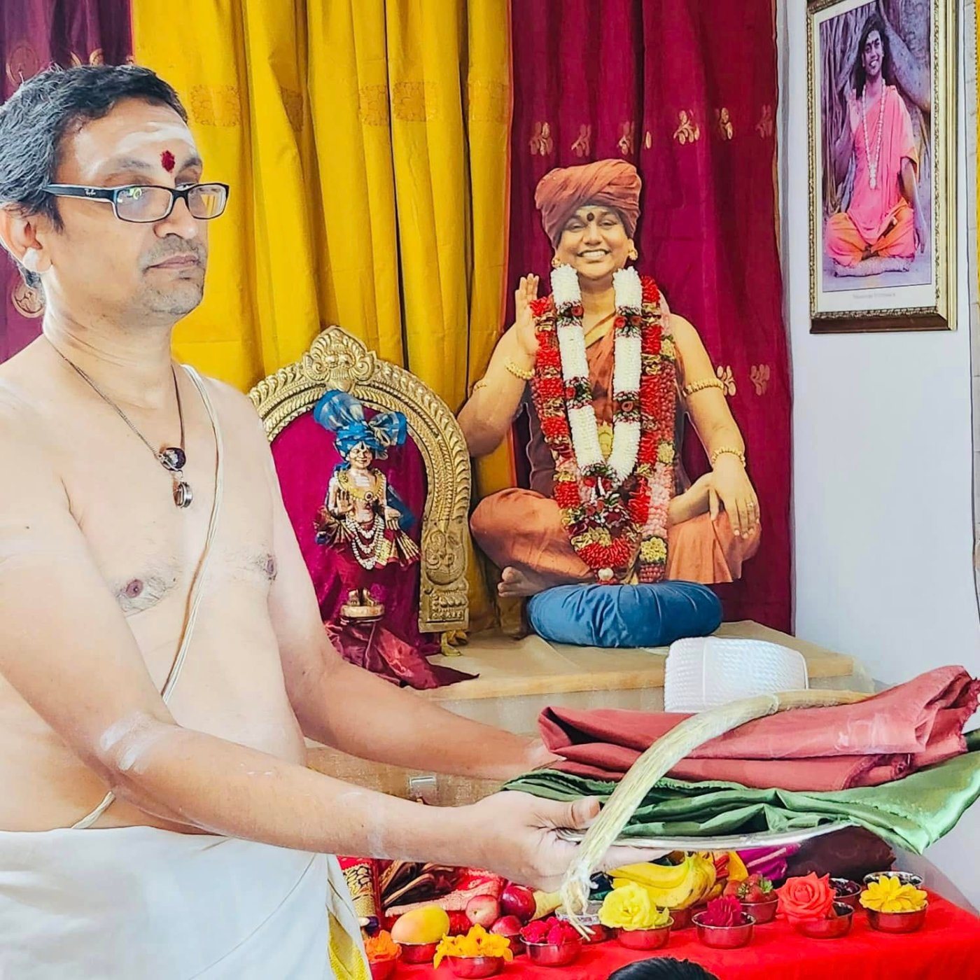 A devotee offering sacred cloth in temple worship